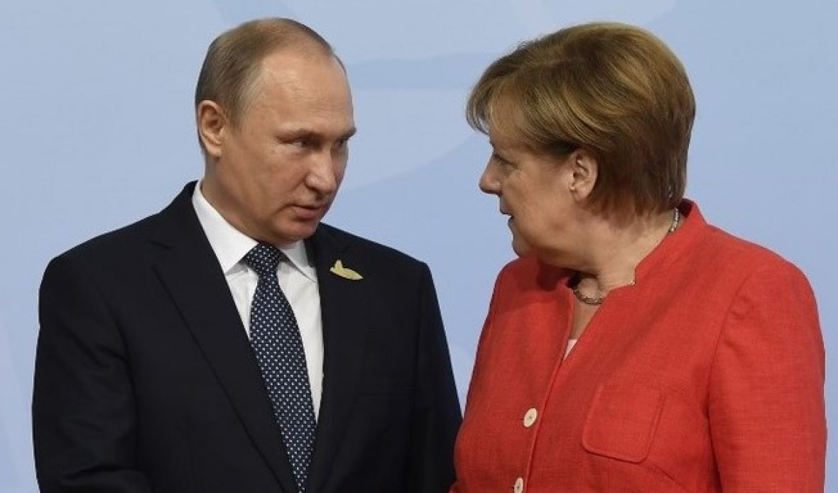AFP/Vladimir Putin i Angela Merkel